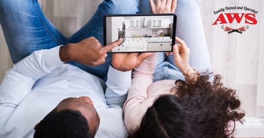 Couple looking at ipad remodel photos