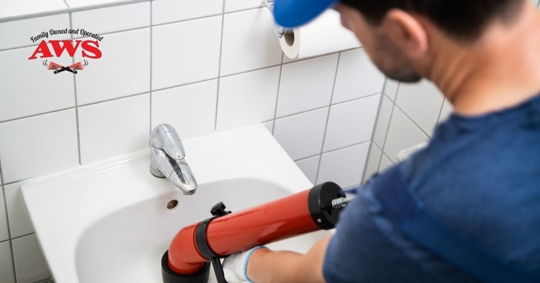 Plumber plunging sink.