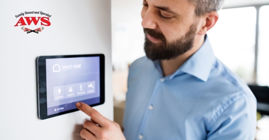 Man touching thermostat.