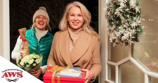 two women standing in front door entryway