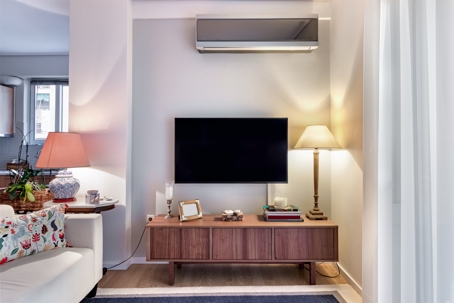 ductless air conditioner above a TV